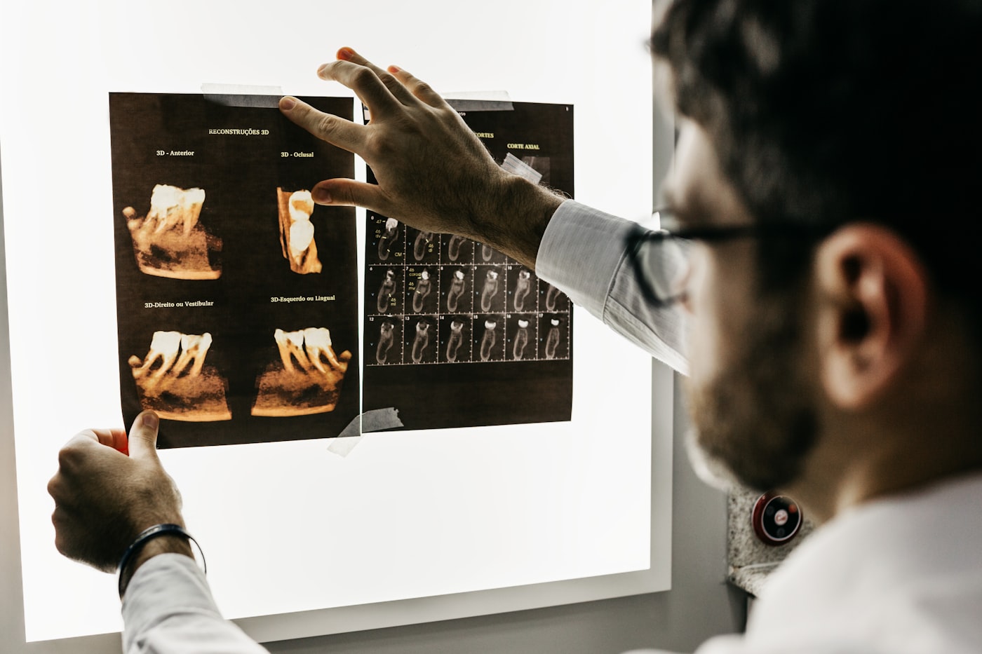 Dentist reviewing dental imaging for a scheduled visit