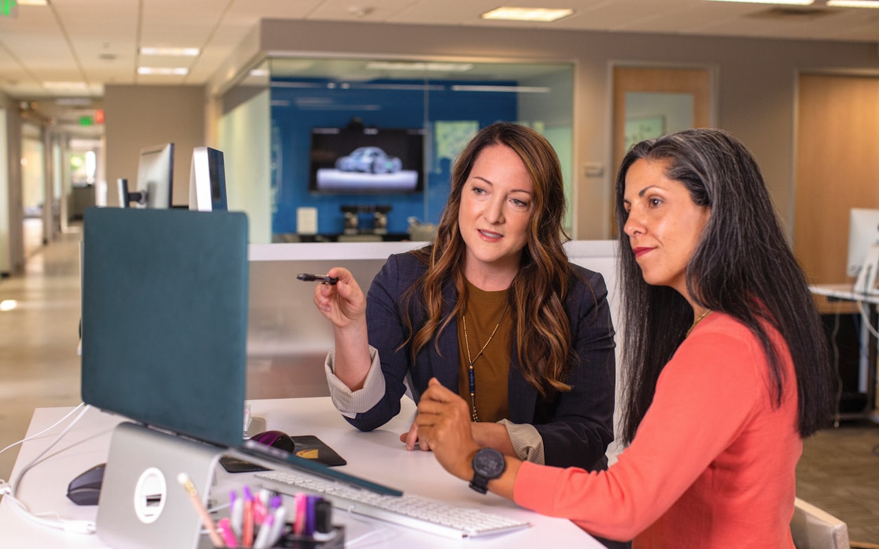 Advisor and client reviewing documents together