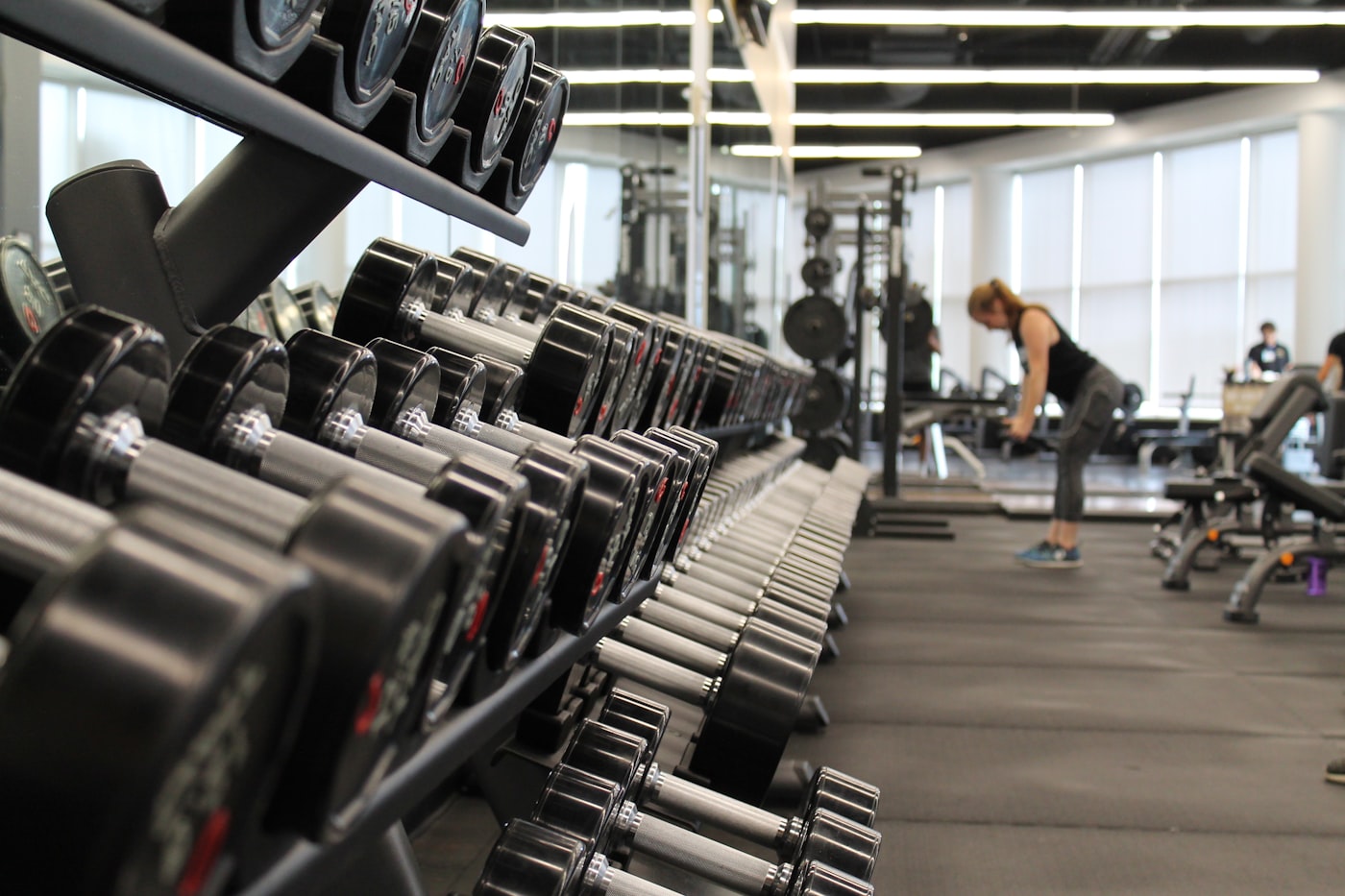 Gym floor with dumbbells waiting while booking calls go unanswered