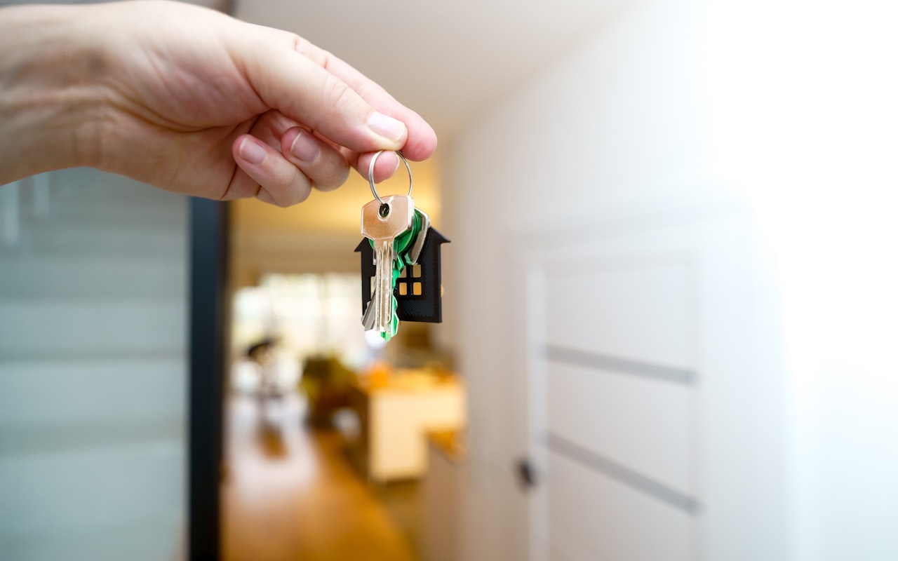 Real estate agent handing over the keys to a new home