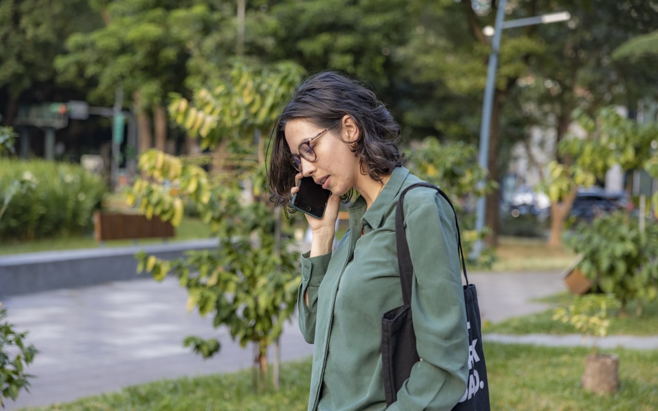 Real estate agent taking a call on the go
