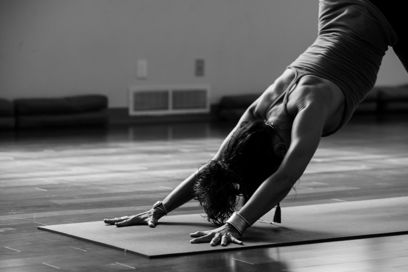 Yoga studio downward dog practice with mats ready for class